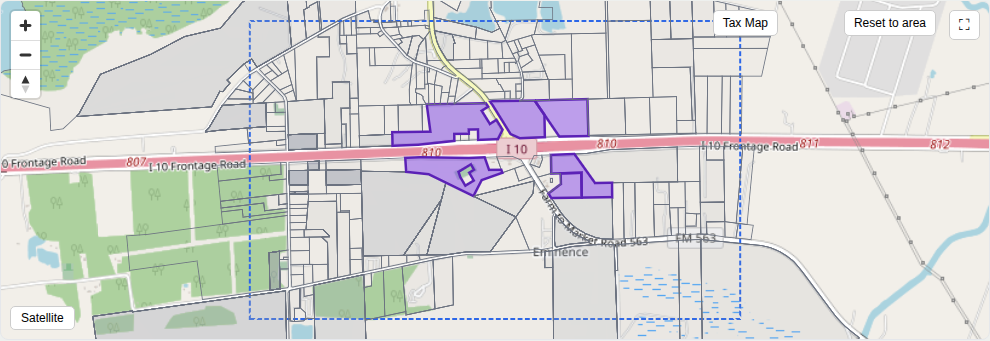 Tax-parcel map of I-10 at FM 563 with the six target parcels highlighted in purple, straddling I-10 near the interchange